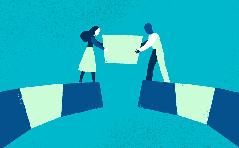 Dos personas construyendo un puente entre sí